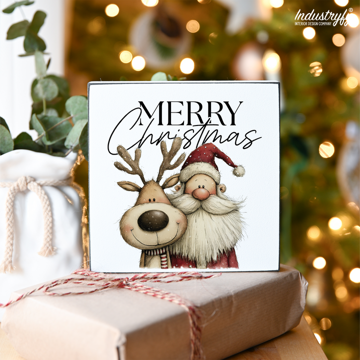 Miniblock Merry Christmas, Weihnachtsdeko mit Santa und Rudolph vor dem Weihnachtsbaum von Industryfy